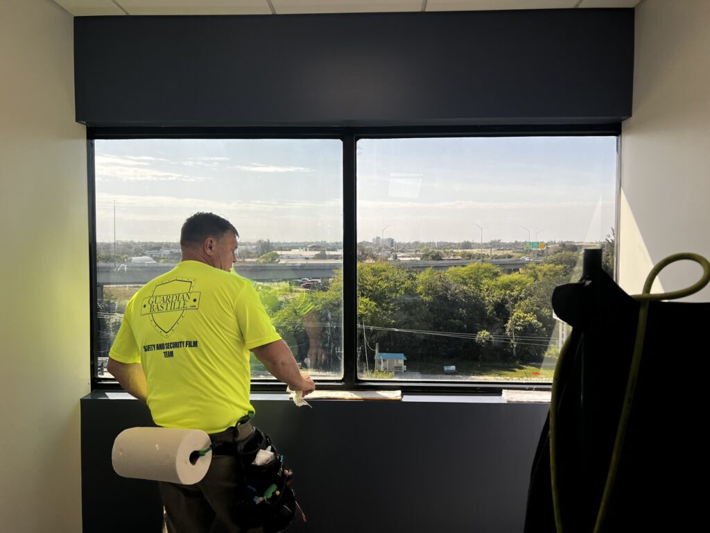 Guardian Bastille technician installing security window film
